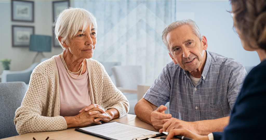 Older couple discussing equity release options with a financial adviser